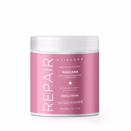 Máscara capilar da linha Haircare da Jacques Janine Professionnel, em embalagem plástica branca e rosa, com rótulo indicando "Reparação Intensa" e "Fórmula Vegana".
