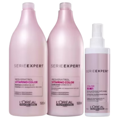 A imagem apresenta três produtos da L’Oréal Professionnel: dois frascos (500ml) rosa claro, e um spray branco e rosa, para cabelos coloridos.