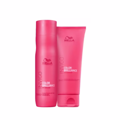Dois produtos da linha Wella Professionals Color Brilliance, em embalagens cilíndricas e tubulares de cor rosa vibrante, com o logotipo da marca e o nome da linha impressos.