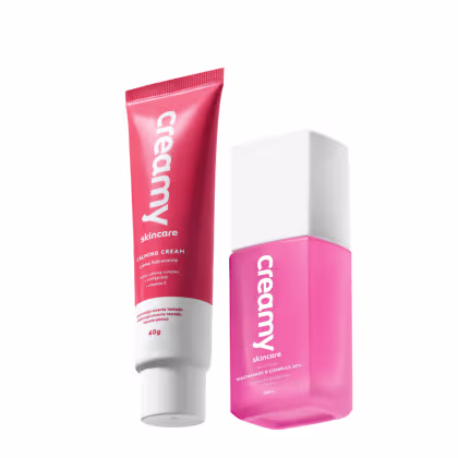 A imagem mostra uma bisnaga pequena de hidratante facial vermelha com detalhe e tampa branca ao lado de um frasco retangular transparente de sérum facial cor rosa e tampa branca.