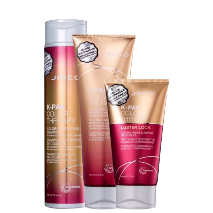 A imagem mostra shampoo, condicionador e máscara "K-Pak Color Therapy" da marca Joico. As embalagens têm uma cor predominantemente vermelha e dourada, com detalhes e letras brancos.