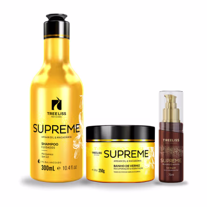 Produtos de cuidados capilares da linha Supreme da marca TreeLiss Profissional. Um shampoo em frasco amarelo de 300ml com rótulo preto, uma máscara de tratamento e um sérum em frasco marrom de 75ml.