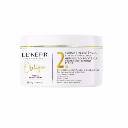 A imagem mostra uma máscara capilar que vem em um pote branco com detalhes em dourado, contendo 250g. O design da embalagem mostra elegância e sofisticação.