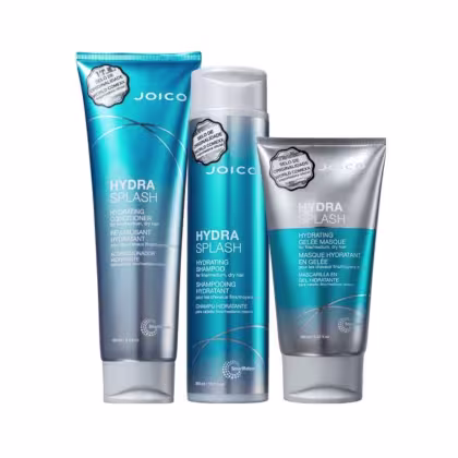 A imagem mostra três produtos da linha Hydra Splash da marca Joico: shampoo, máscara e condicionador, ambos em embalagens na cor azul, com detalhes em prata e branco.
