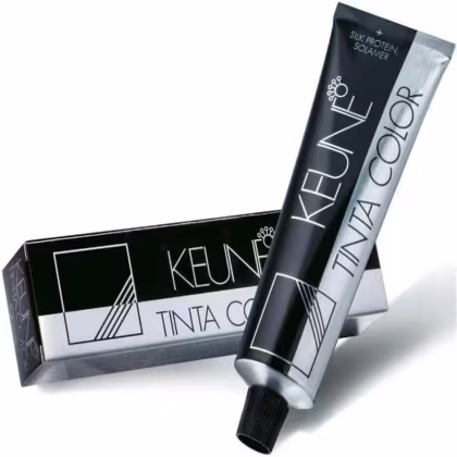 Tinta de cabelo da marca Keune. A embalagem consiste em uma caixa preta com detalhes em branco e cinza, exibindo o nome da marca "Keune" e a descrição "Tinta Color".