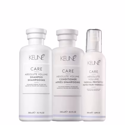 A imagem mostra três produtos da linha Keune Care Absolute Volume, incluindo um shampoo, um condicionador e um protetor térmico.