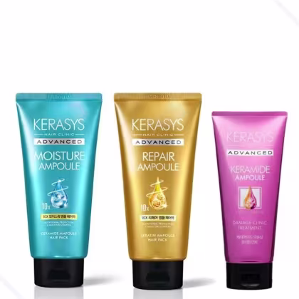 Três frascos de tratamentos capilares da marca Kerasys: Moisture Ampoule em azul, Repair Ampoule em dourado e Ceramide Ampoule em rosa, com rótulos indicando os benefícios avançados de cada produto.