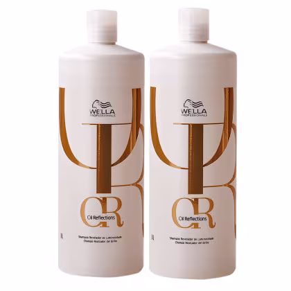 São dois frascos de shampoo Oil Reflections da marca Wella Professionals de 1 litro. Os frascos têm formato cilíndrico e apresentam detalhes em dourado, incluindo o logotipo da Wella e o nome "Oil Reflections.