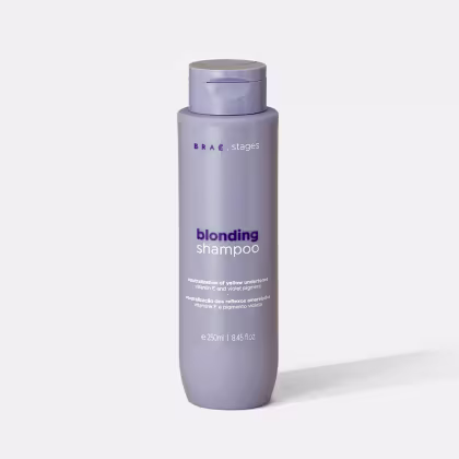 Frasco de shampoo Braé Stages para loiros, em tom de roxo, com rótulo destacando a função de neutralizar reflexos amarelados e pigmentos violetas, com volume de 250ml.