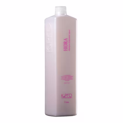 Hidra Shampoo Hidratante Nutritivo da linha K.Pro. Embalagem plástica na cor rosa claro. Rótulo com o nome do produto "HIDRA" em letras maiúsculas rosa e a descrição "shampoo hidratante nutritivo" abaixo em letras menores.