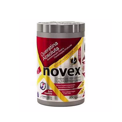 A imagem mostra o Creme de Tratamento Queratina Absoluta 400g da marca Novex. O pote é vermelho, amarelo e prateado. Traz a indicação para cauterização profunda de cabelos frágeis e sem vida.