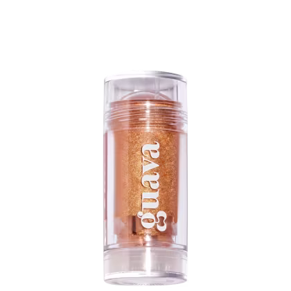 Produto de beleza Guava Skin em embalagem cilíndrica transparente, contendo um pó dourado brilhante. O rótulo do produto exibe o nome "Guava" em letras brancas.
