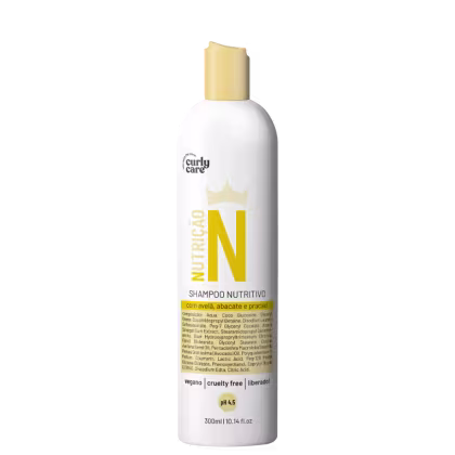 Shampoo nutritivo em frasco plástico branco de 300ml. Rótulo com texto "Nutricao N" em letras amarelas e coroa estilizada acima. Descrição dos ingredientes como avelã, abacate e pracaxi. Indica ser vegano, livre de crueldade e liberado. Detalha pH 4,5.
