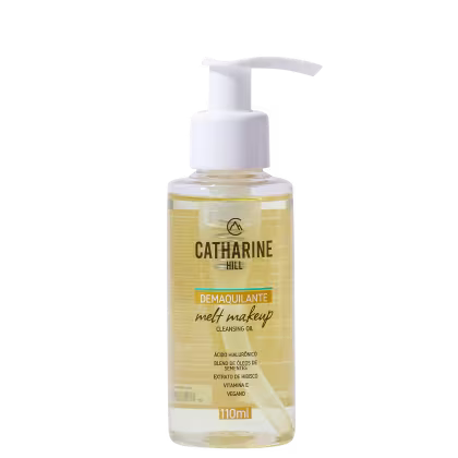 Frasco de óleo de limpeza facial da marca Catharine Hill, com bomba doseadora branca. Rótulo amarelo com o nome do produto "Demaquilante Melt Makeup Cleansing Oil" e informações sobre os ingredientes.
