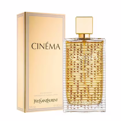 Frasco de perfume Yves Saint Laurent Cinema, com embalagem dourada e detalhes em preto. O frasco possui um design geométrico com padrão de texto impresso. O produto é apresentado em uma caixa de papelão bege com o nome da marca e do perfume.