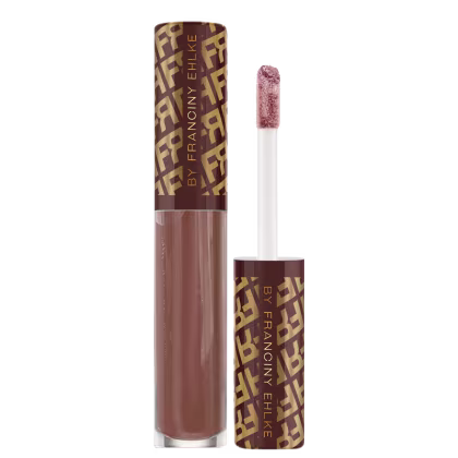 Gloss da marca Fran by Franciny Ehlke, com embalagem em tons de marrom e amarelo, contendo um aplicador de maquiagem com textura aveludada.