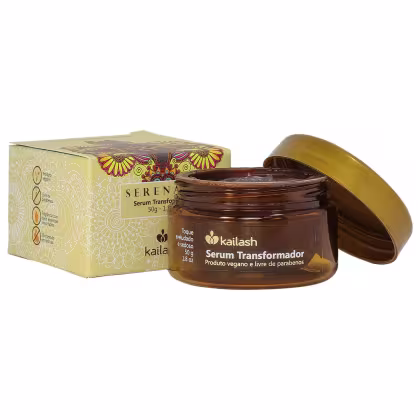 Caixa de papelão amarela com padrões florais e frasco de vidro marrom contendo Serum Transformador da marca Kailash, um produto vegano e livre de parabenos, com 50g de conteúdo.