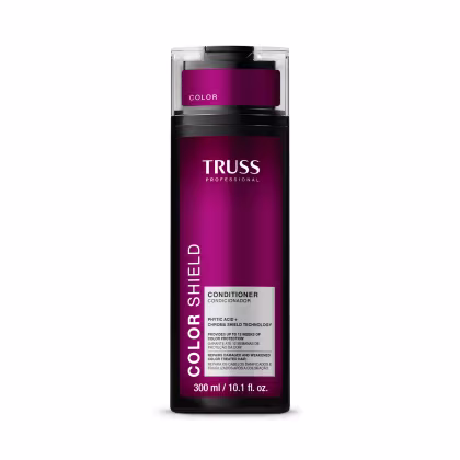 Frasco de condicionador da marca Truss Professional, na cor rosa escuro, com rótulo destacando o nome da marca e a tecnologia "Color Shield" para proteção da cor.