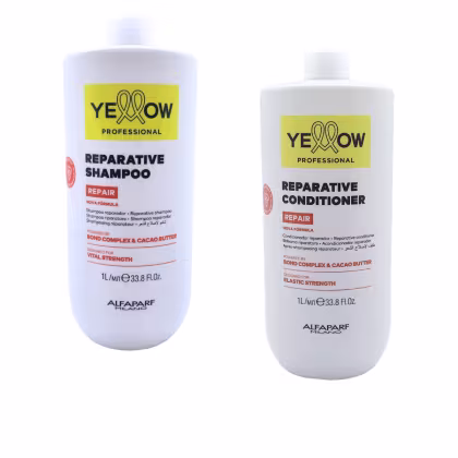 Dois frascos brancos da linha Yellow Professional, um contendo shampoo reparador e outro condicionador reparador, ambos com rótulos amarelos destacando a marca e a fórmula "Repair" com manteiga de cacau.