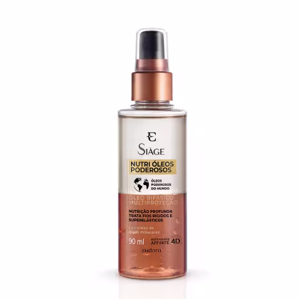 Frasco transparente com óleo alaranjado na parte inferior e transparente na parte superior. Rótulo com texto em preto e laranja. Tampa preta e detalhes em cobre.