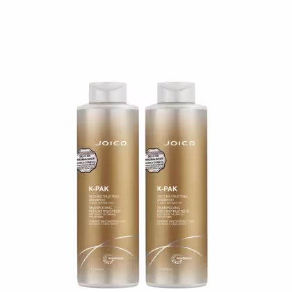 Dois frascos de shampoo reconstrutor Joico K-Pak, com embalagem em tons dourados e brancos, apresentando rótulos com o nome da marca e informações sobre o produto.