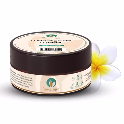 O produto apresentado é um pote de manteiga de monoi da marca Oleoterapia Brasil. Junto ao pote, há uma flor amarela de Tiaré