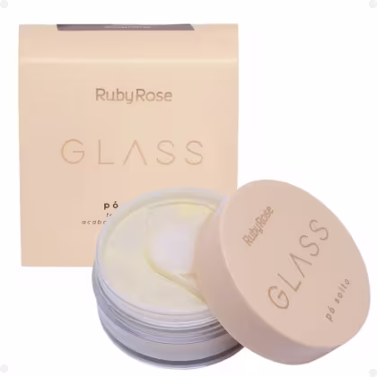 Pó solto da marca Ruby Rose, chamado "Glass". O rótulo na embalagem exibe o nome da marca "Ruby Rose" e o nome do produto "Glass" em letras douradas. A caixa de papelão que acompanha o produto também é bege, com o nome "Ruby Rose Glass" impresso nela.