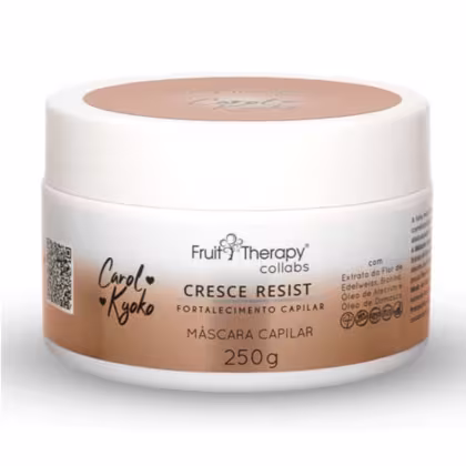 A imagem mostra um pote de plástico branco com tampa rosada que contém uma máscara capilar de 250g. É descrito que é uma máscara fortalecedora que contém extrato de flor de edelweiss, óleos de alecrim e damasco.