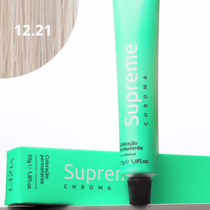 A imagem mostra a embalagem em tubo plástico verde claro com o nome da marca e produto impresso. Caixa retangular verde com detalhes do produto, incluindo a cor e o volume de 50g. No canto superior há uma pequena mecha com o tom da coloração.