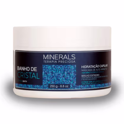 A imagem traz a máscara de tratamento da linha Minerals Terapia Preciosa Banho de Cristal. O produto vem em um pote de 250g feito de plástico branco com rótulo azul, e promete hidratação capilar de alto impacto e brilho extremo aos fios.