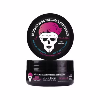 Bálsamo para estilizar penteados da marca Studio Hair, com embalagem preta e rosa, exibindo um crânio estilizado com cabelo rosa. O produto é indicado para tranças e contém 120g.