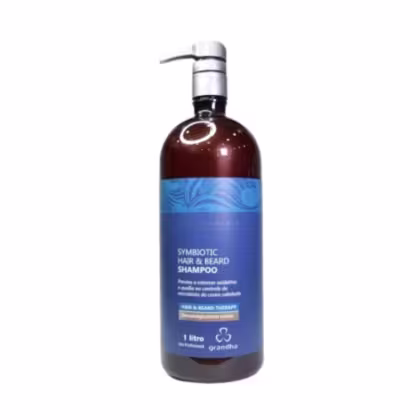 Frasco de 1 litro de shampoo para cabelo e barba da marca Grandha, com design azul e marrom, contendo a descrição "Symbiotic Hair & Beard Shampoo" no rótulo.