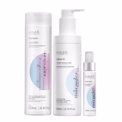 Conjunto de produtos Emáh Hair Care, incluindo shampoo, leave-in e máscara líquida, em embalagens brancas com detalhes em tons pastel. Cada produto apresenta informações sobre seus benefícios e sistema de ácido hialurônico.