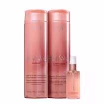 Dois frascos de shampoo e condicionador da linha Revival da marca Brae, em embalagens rosadas com detalhes em dourado, e um frasco de óleo capilar da mesma marca.