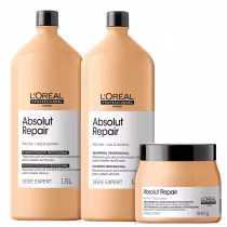Produtos de tratamento capilar da linha Absolut Repair da L'Oréal Professionnel. Dois frascos plásticos grandes de 1,5 litros na cor bege, um contendo shampoo e outro condicionador. Um pote plástico menor de 500g na mesma cor bege.