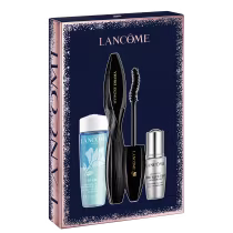 É um conjunto de produtos de maquiagem e cuidados com a pele da marca Lancôme. O conjunto vem em uma caixa retangular azul marinho decorada com padrões de flocos de neve prateados.