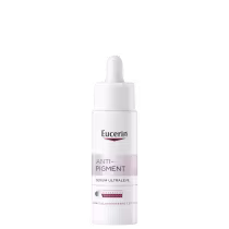 A imagem mostra um sérum redutor de marcas em frasco plástico branco opaco com conta-gotas. Cores predominantes são branco e letras em tons de cinza e rosa claro.