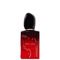 O frasco possui um formato retangular com uma tampa oval, com a marca "Giorgio Armani" impressa em destaque. A cor predominante é o vermelho escuro, com um acabamento brilhante.