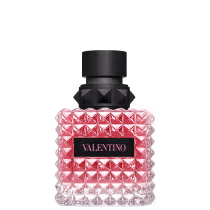 Frasco de perfume Valentino com design geométrico em vidro rosa e detalhes em preto, contendo o nome da marca em destaque.