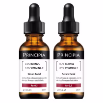 Dois frascos de soro facial Principia contendo 0,3% de retinol e 0,5% de vitamina E, com rótulos pretos e âmbar, apresentando informações sobre o produto em português.