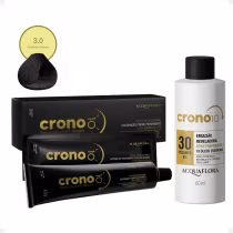 Caixa preta com rótulo "Crono" contendo tubos de coloração creme permanente da marca Acquaflora, acompanhada de emulsão reveladora em frasco branco com rótulo "Crono 10".