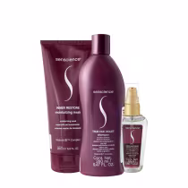Produtos da marca Senscience: máscara hidratante Inner Restore, shampoo True Hue Violet e tratamento capilar True Hue Color, em embalagens de plástico e vidro com predominância de tons de roxo.