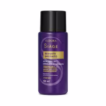Frasco de 150 ml da linha Siàge da Eudora, com rótulo roxo e dourado, contendo "Resgate Imediato", um produto para cuidados com as cutículas e fibras danificadas dos cabelos.