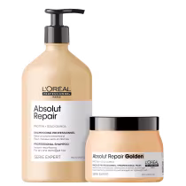 A imagem mostra dois produtos de cuidado capilar da linha Absolut Repair da L'Oréal Professionnel. Um é um shampoo em uma embalagem plástica na cor bege claro. O outro é uma máscara capilar em um pote plástico perolado na mesma cor bege.