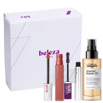 A caixa branca contém produtos de beleza, incluindo um batom líquido de cor rosada, uma máscara de cílios e um frasco de óleo de reparação da marca L'Oréal Professionnel.