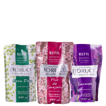 Pacotes de refil de sabonete líquido Fiorucci em embalagens de 440 ml, com rótulos nas cores verde, rosa e roxo, exibindo os nomes dos fragrâncias: Erva Doce, Flor de Cerejeira e Lavanda.