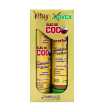 A imagem mostra caixa com kit de shampoo e condicionador Embelleze Novex Óleo de Coco, de 300ml. A embalagem traz tons de marrom e dourado e ilustrações de coco. Destaca benefícios como hidratação, nutrição, revitalização e brilho.