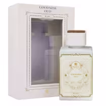 Caixa retangular branca com detalhes dourados e o nome do produto "Goodness Oud Blanc" em letras estilizadas. Frasco de vidro branco e rótulo dourado ornamentado com o nome do perfume e da marca. As cores predominantes são branco, dourado e marrom claro.