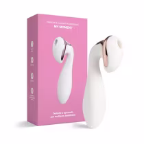 O produto apresentado é um vibrador e sugador recarregável chamado "My Moment", em uma caixa rosa. O dispositivo é branco com detalhes em rosa dourado, com um formato ergonômico e compacto.
