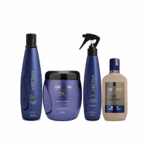 A imagem mostra um kit com 4 produtos da Linha A de Aneethun. Sendo: um frasco de shampoo, um pote redondo de máscara capilar e um frasco em spray de tratamento capilar. Todos com embalagens na cor azul, exceto o frasco do creme capilar que é bege.